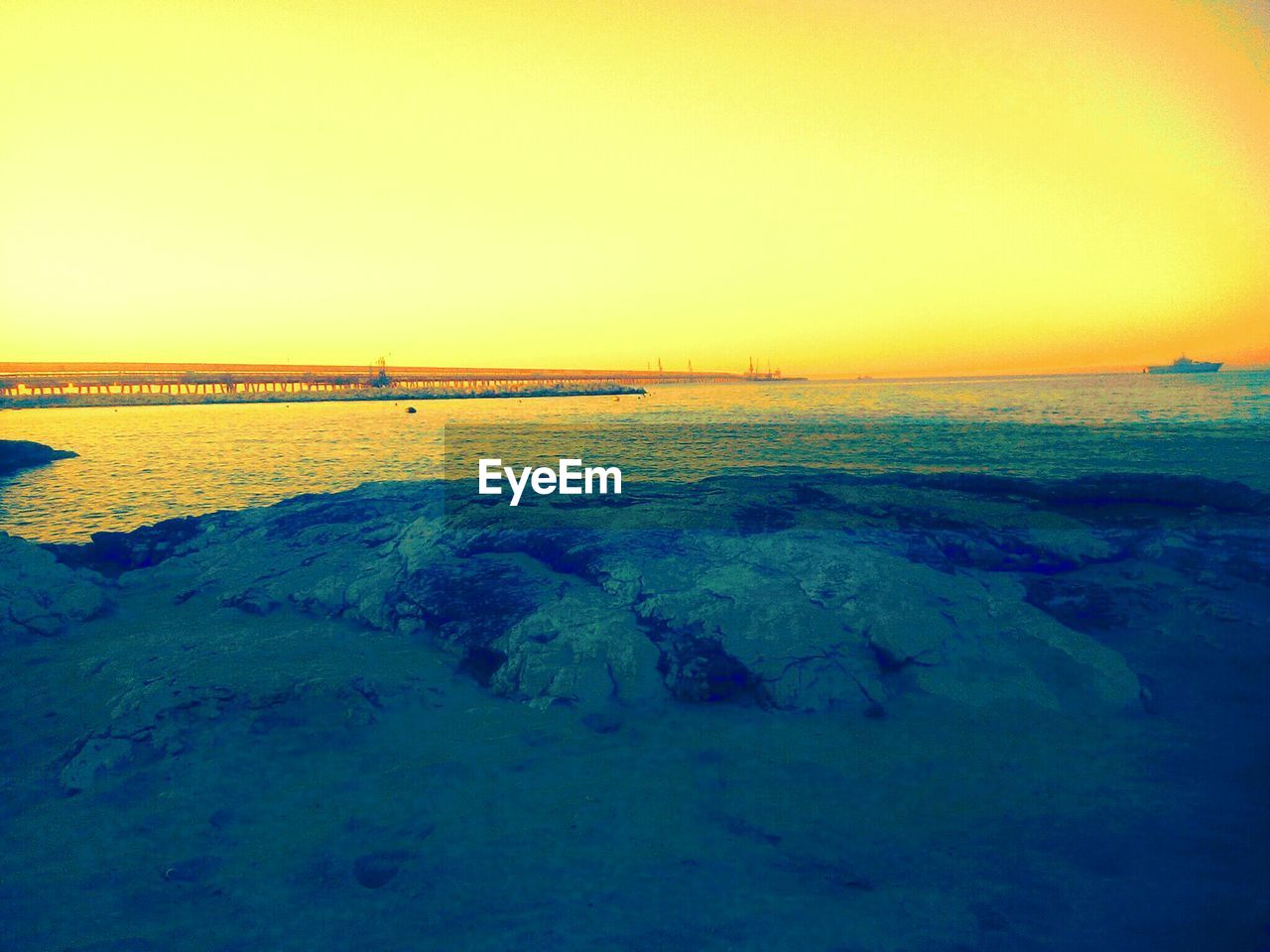 SCENIC VIEW OF BEACH AGAINST CLEAR SKY