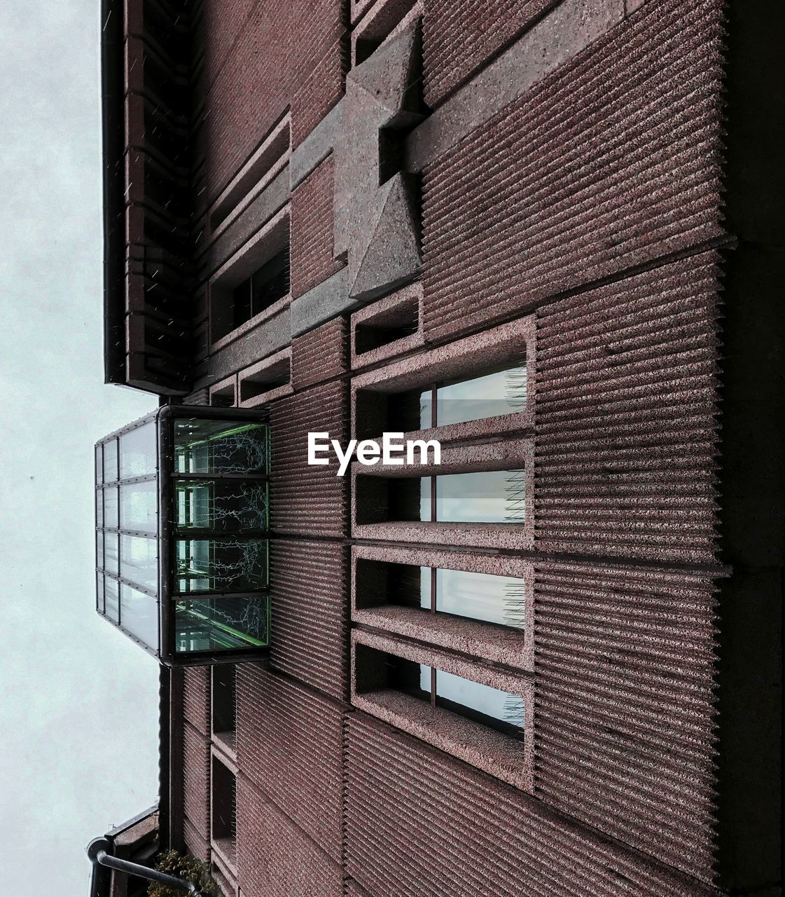 LOW ANGLE VIEW OF TEXT ON BUILDING AGAINST SKY