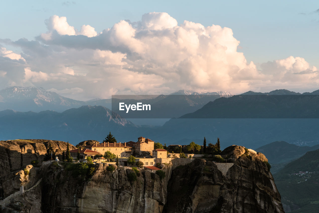 Panoramic view of mountains against cloudy sky