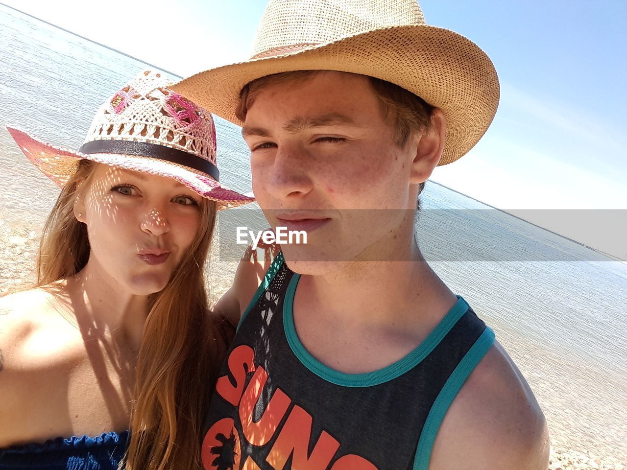 Portrait of young couple on beach