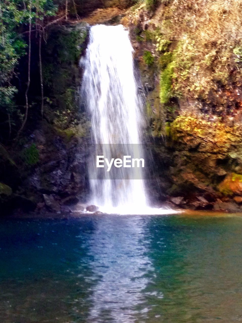 VIEW OF WATERFALL WITH CLIFF