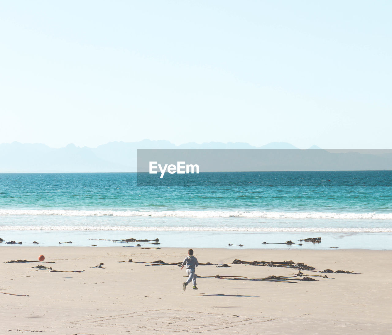 Boy running on beach