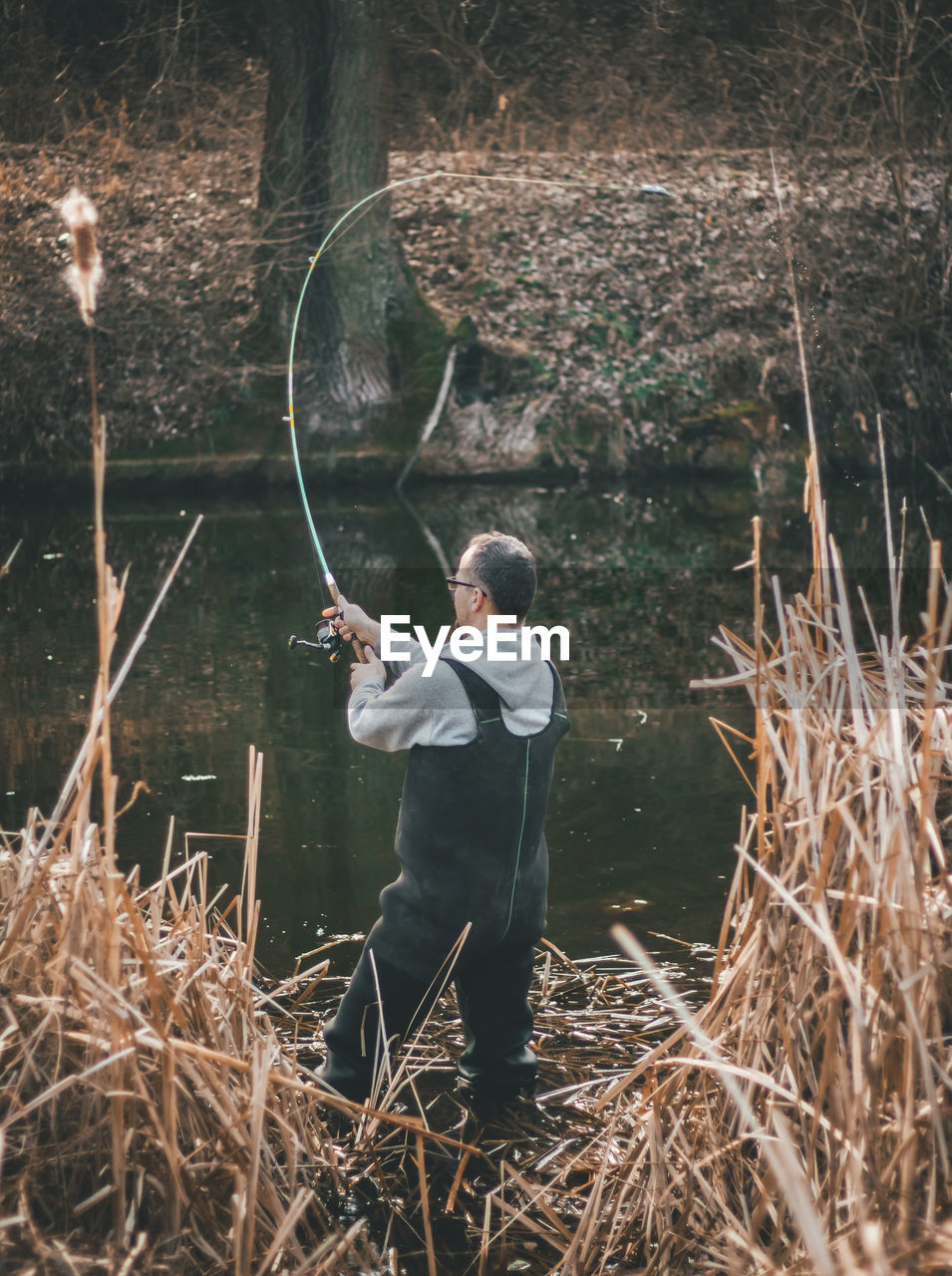 Man fishing in lake