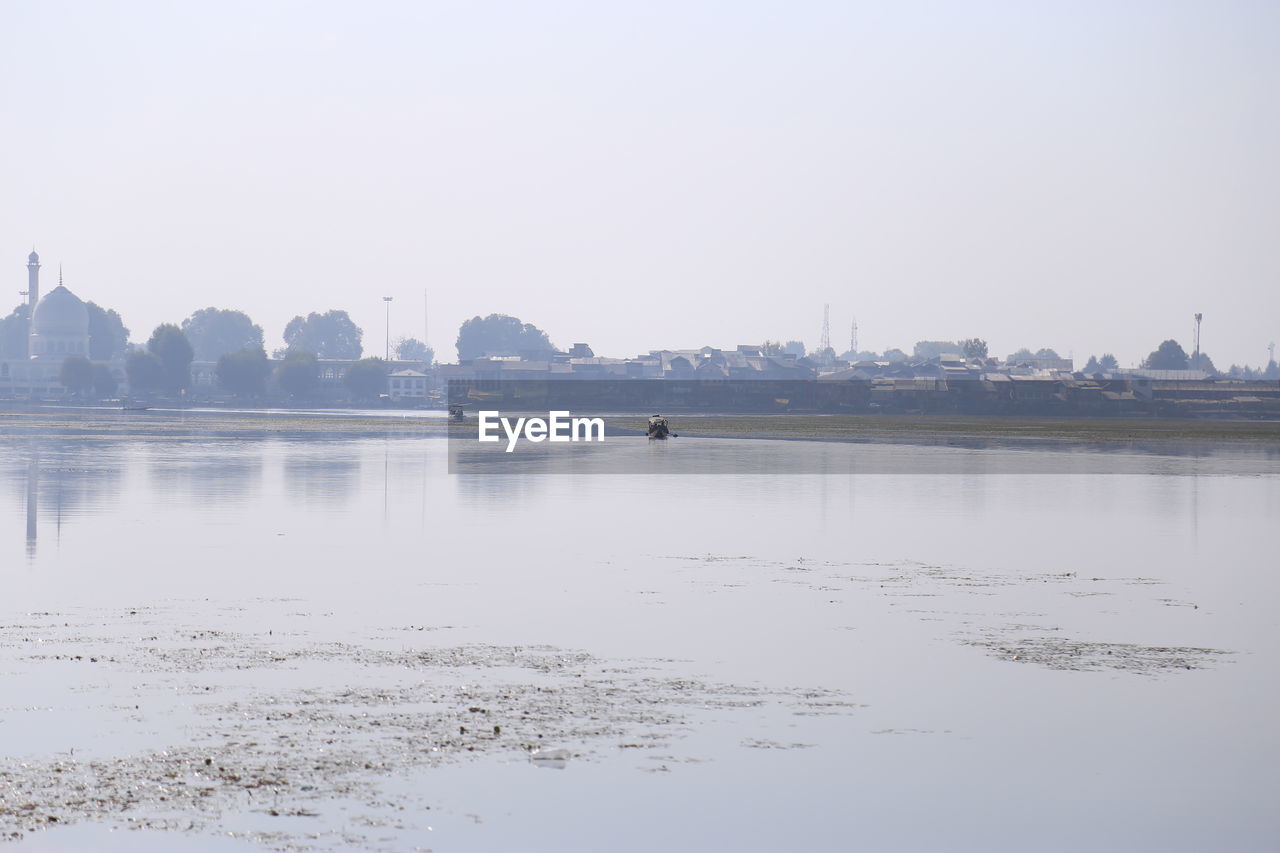 VIEW OF LAKE AGAINST CLEAR SKY