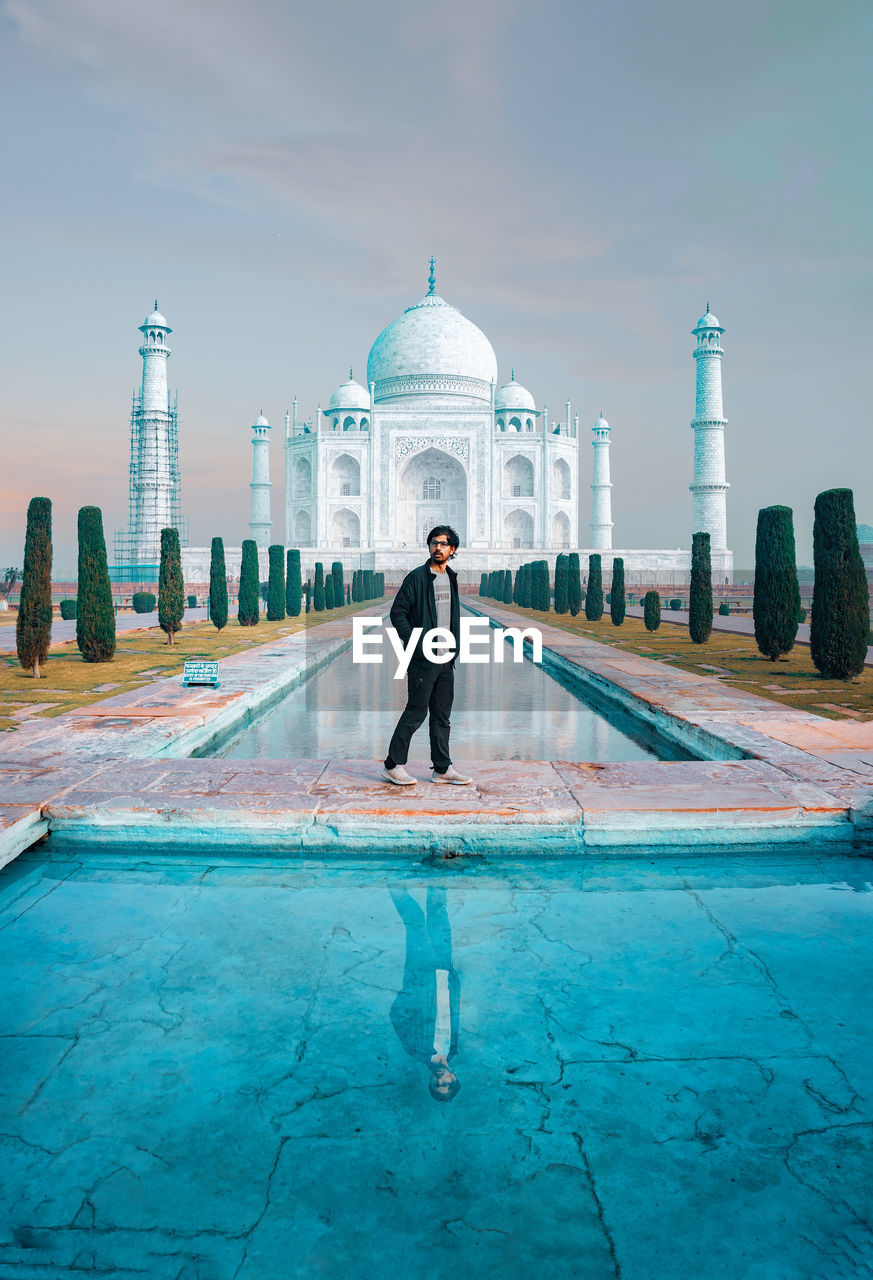 Full length of man standing against taj mahal