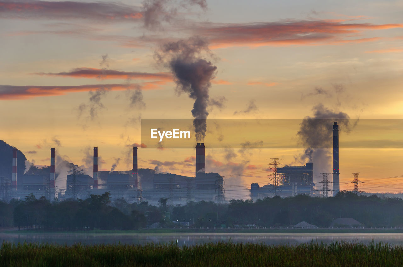 Coal power plant and steam from the flue in the morning.