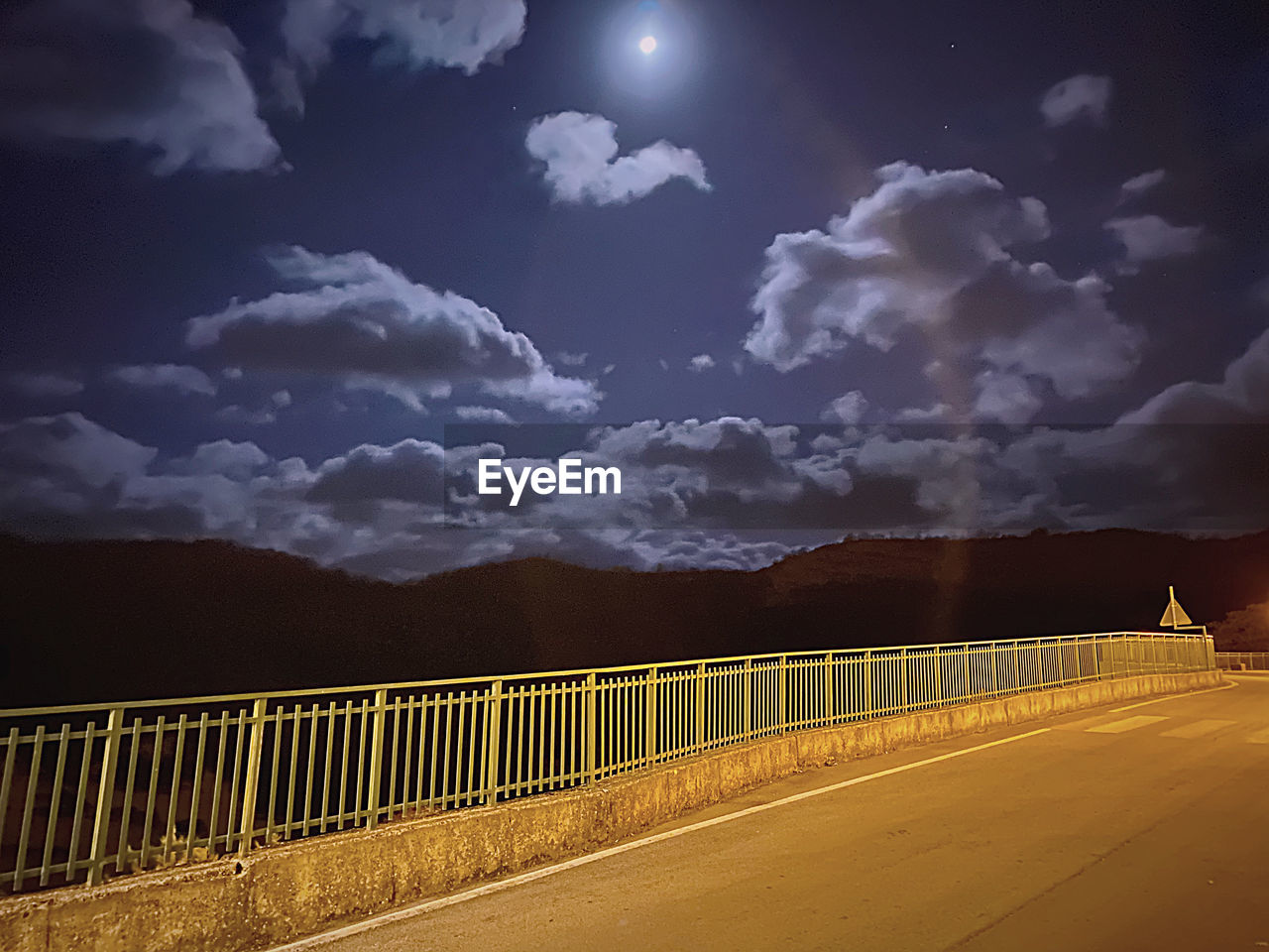 BRIDGE OVER ROAD AGAINST SKY