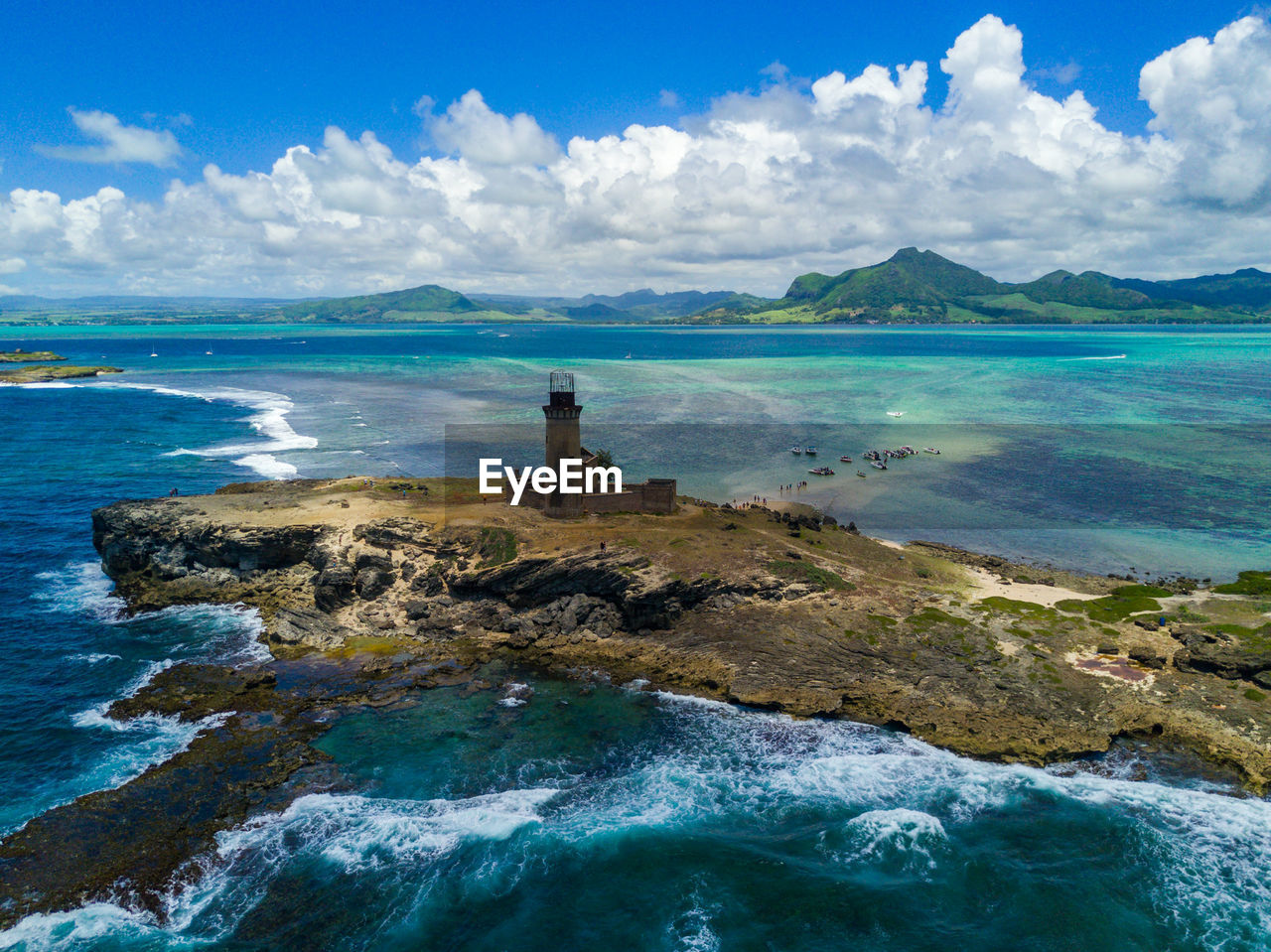 Scenic view of sea against cloudy sky