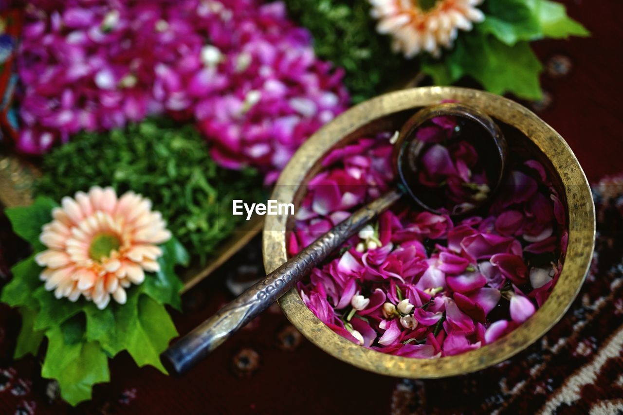 flower, flowering plant, plant, freshness, floristry, purple, pink, nature, no people, bouquet, close-up, beauty in nature, petal, food and drink, floral design, high angle view, container, food, flower head, wellbeing, indoors, healthy eating, focus on foreground, multi colored, basket, leaf