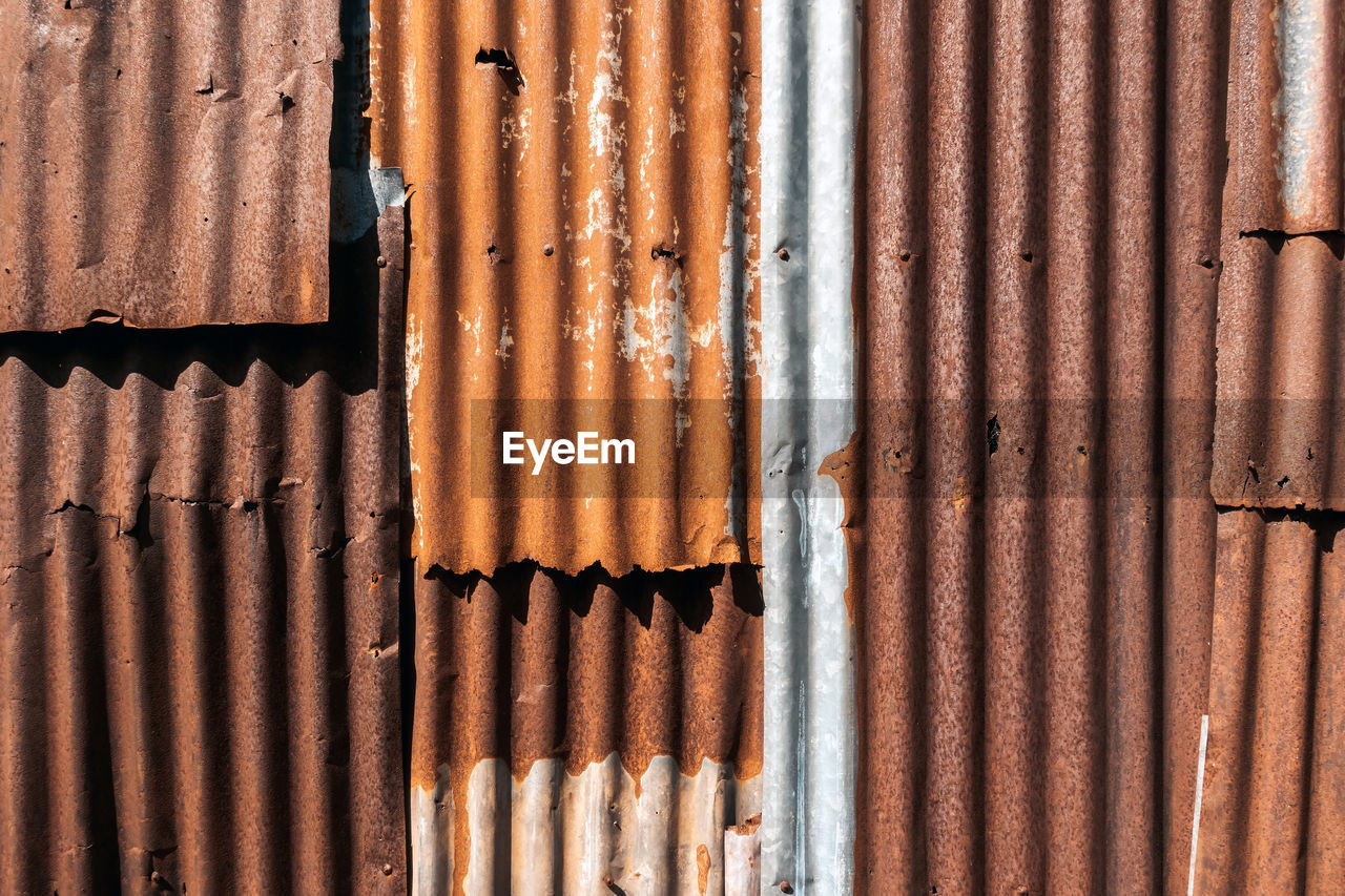 full frame, backgrounds, metal, pattern, wood, interior design, corrugated iron, iron, no people, rusty, window covering, wall, day, corrugated, textured, line, close-up, sunlight, wall - building feature, architecture, brown, weathered, outdoors, old, built structure, repetition