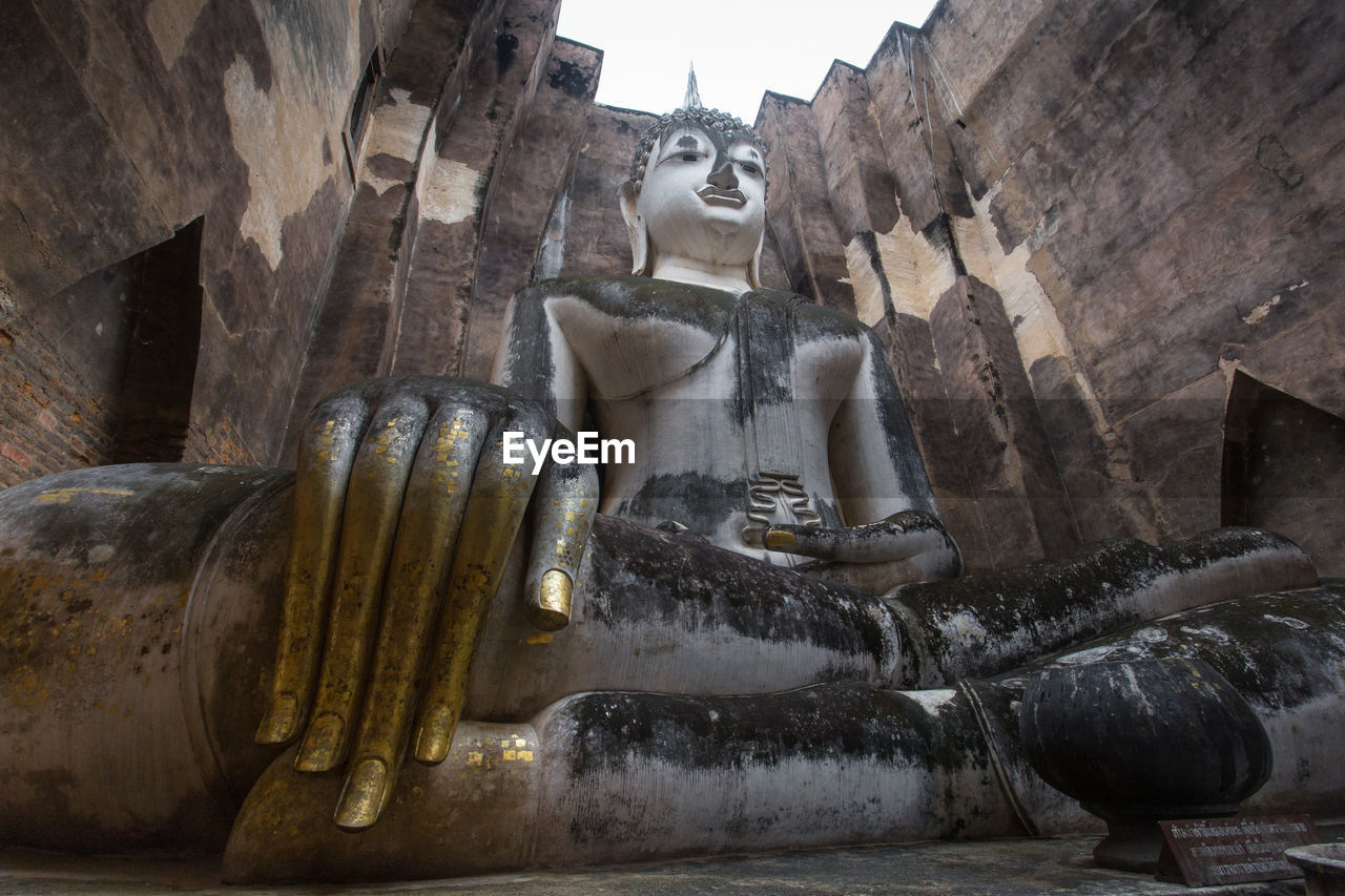 Low angle view of buddha statue