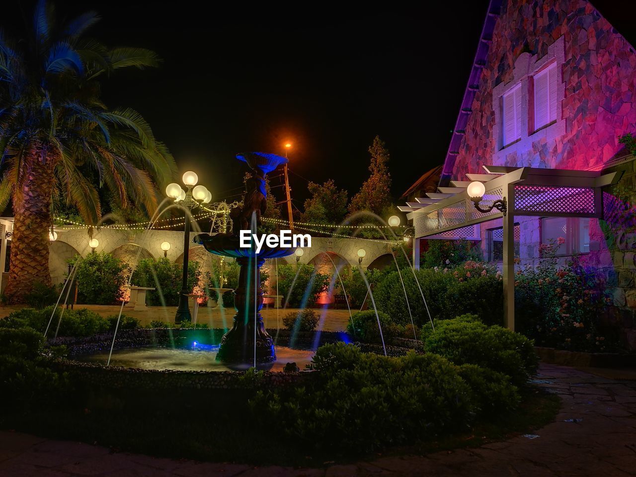 VIEW OF SWIMMING POOL AT NIGHT