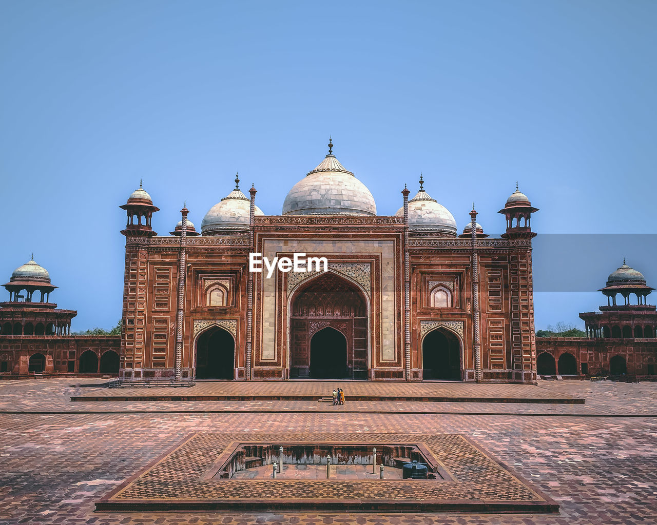 Facade of historical building against clear sky