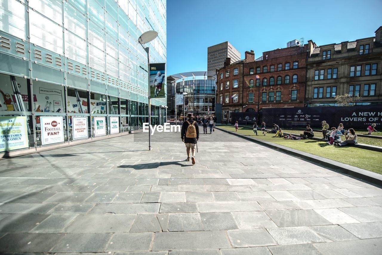 People walking on street in city