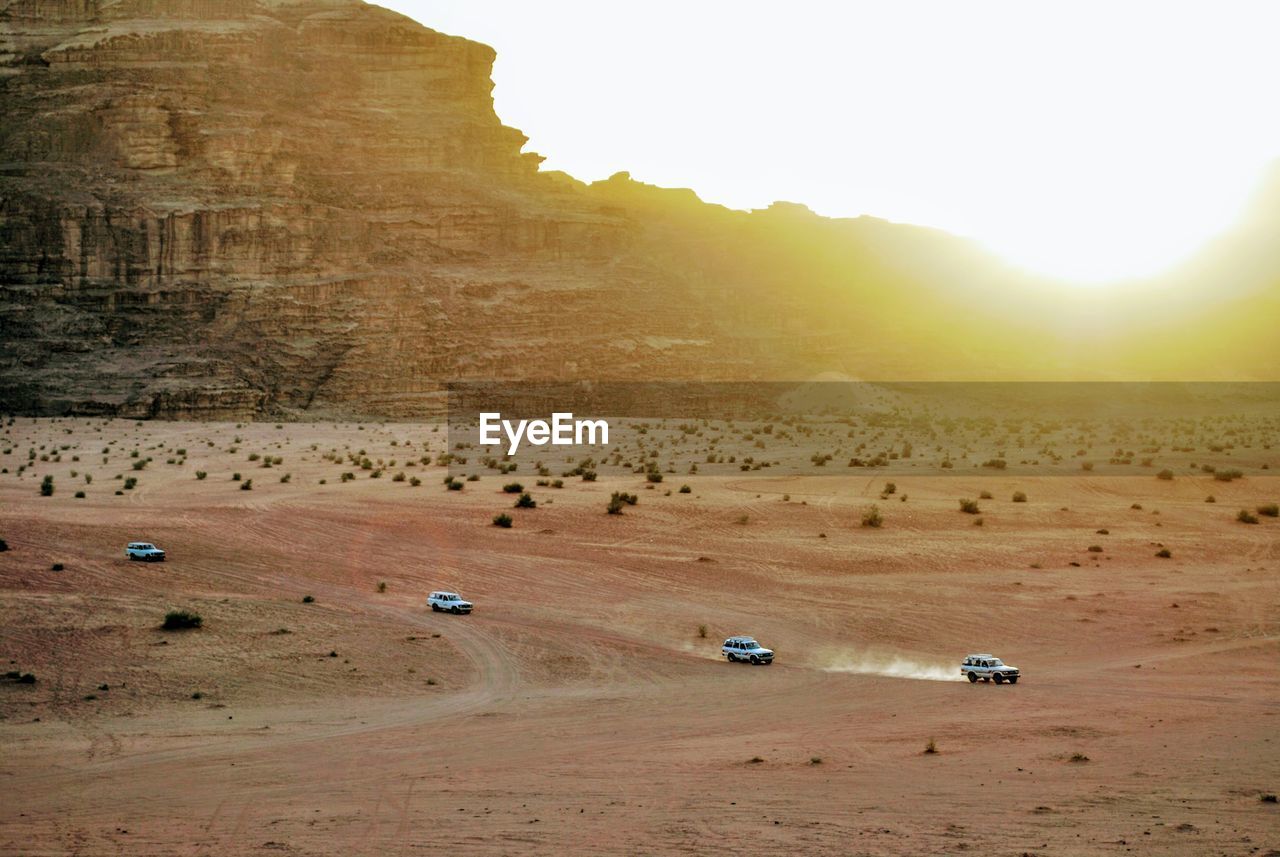 High angle view of people on sand dunes at beach