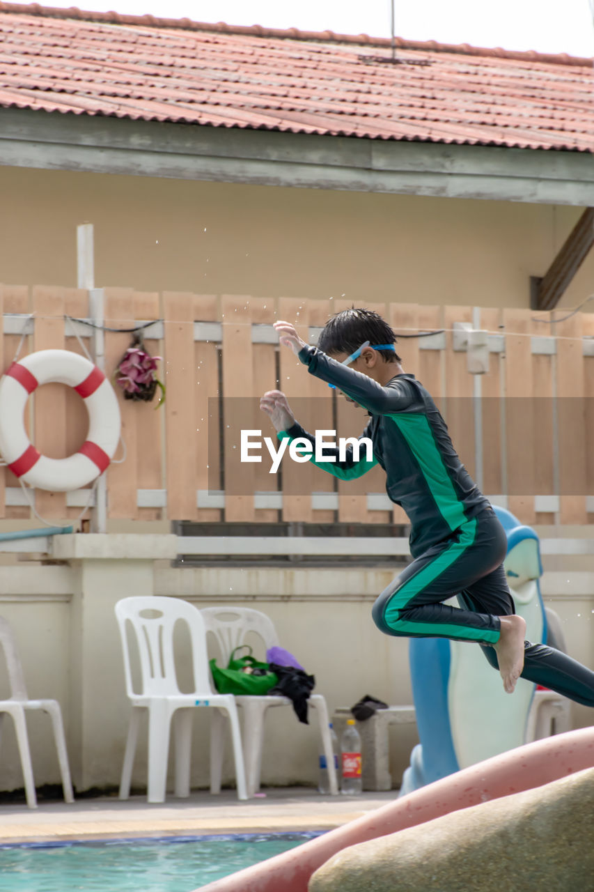 Boy diving into swimming pool