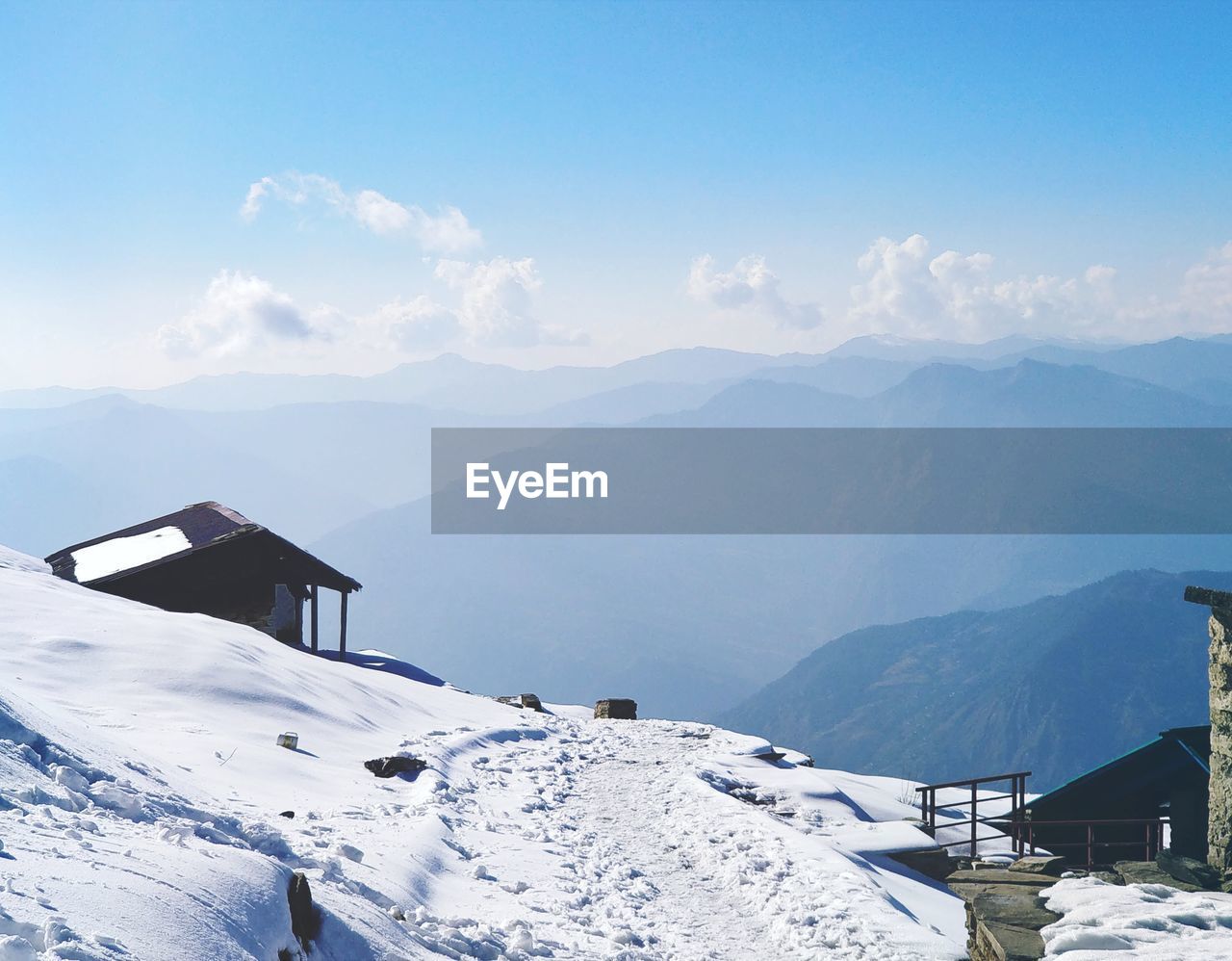 Scenic view of snowcapped mountains against sky