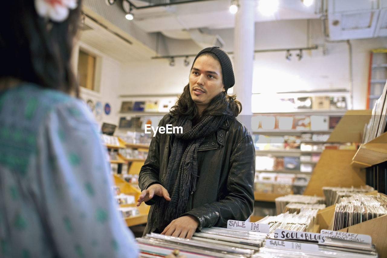 People talking in a record store