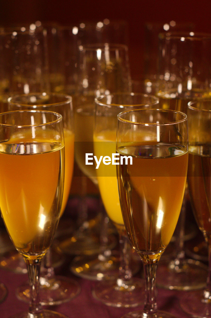 Close-up of champagne flutes on table