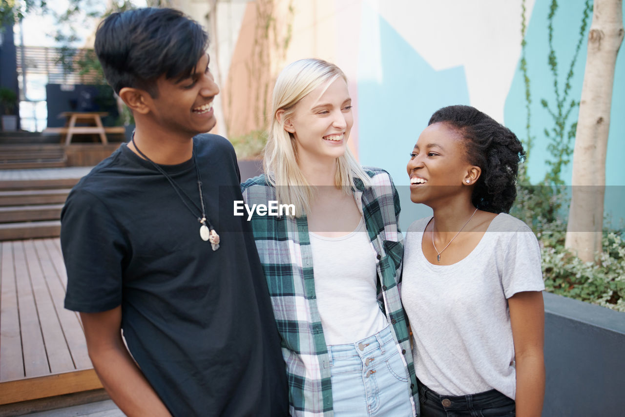 Cheerful friends enjoying outdoors