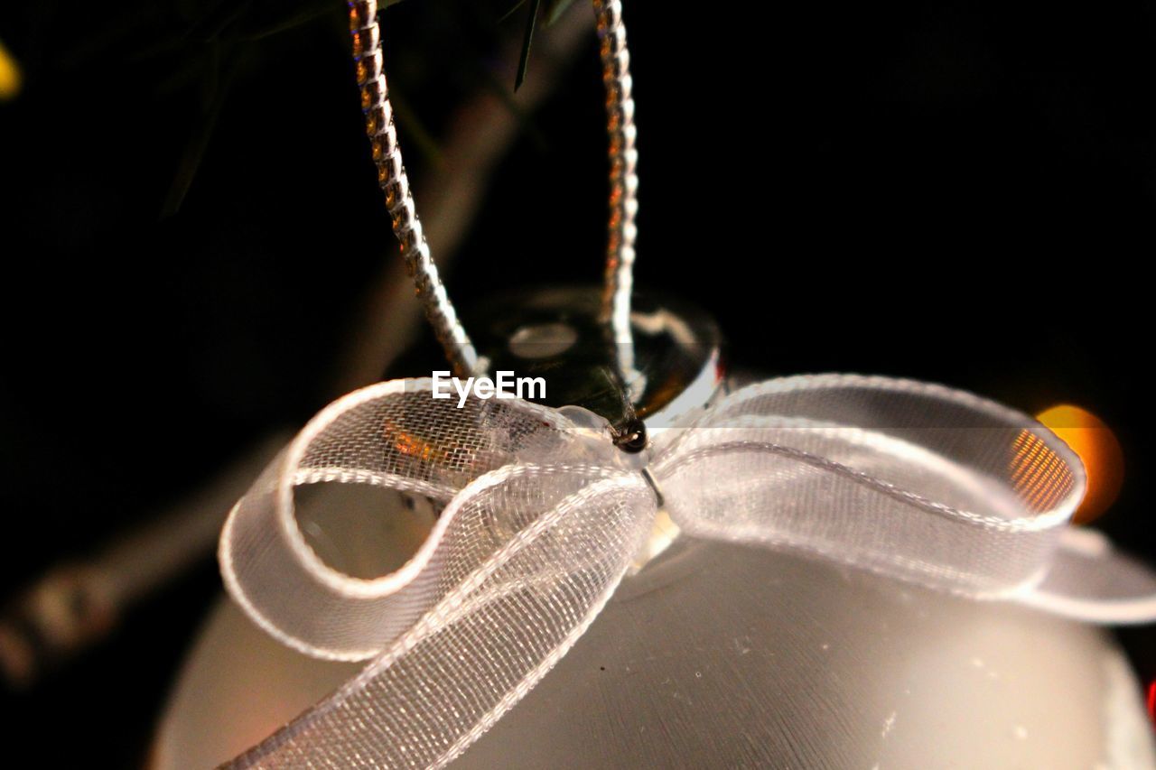 Close up of bauble hanging on christmas tree