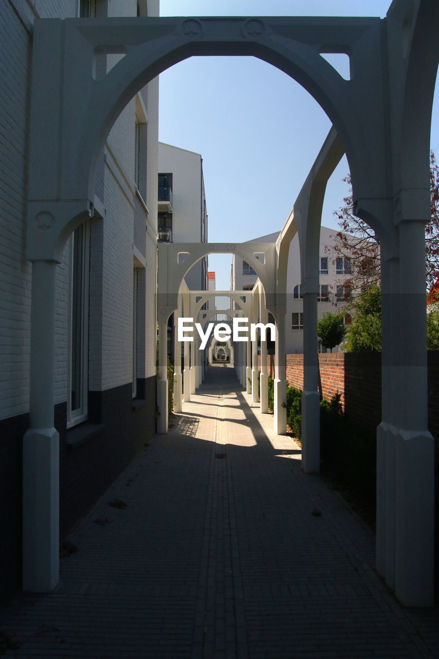 Alley amidst buildings in city