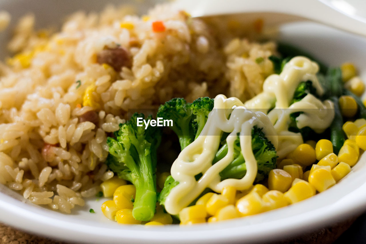 Close-up of fried rice and vegetables in bowl