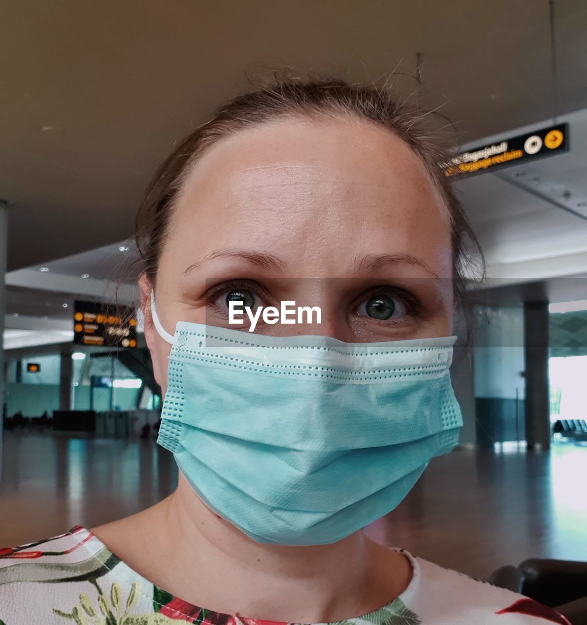 Close-up portrait of a young woman wearing face mask