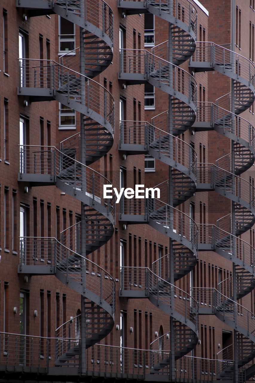 Full frame shot of modern back stairs buildings in city.