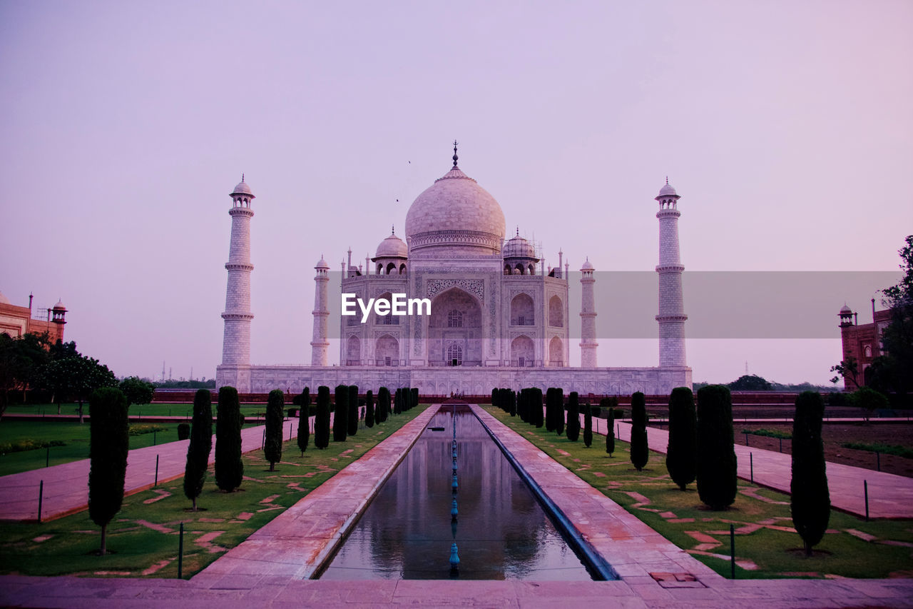 Taj mahal tomb reflected in still waters