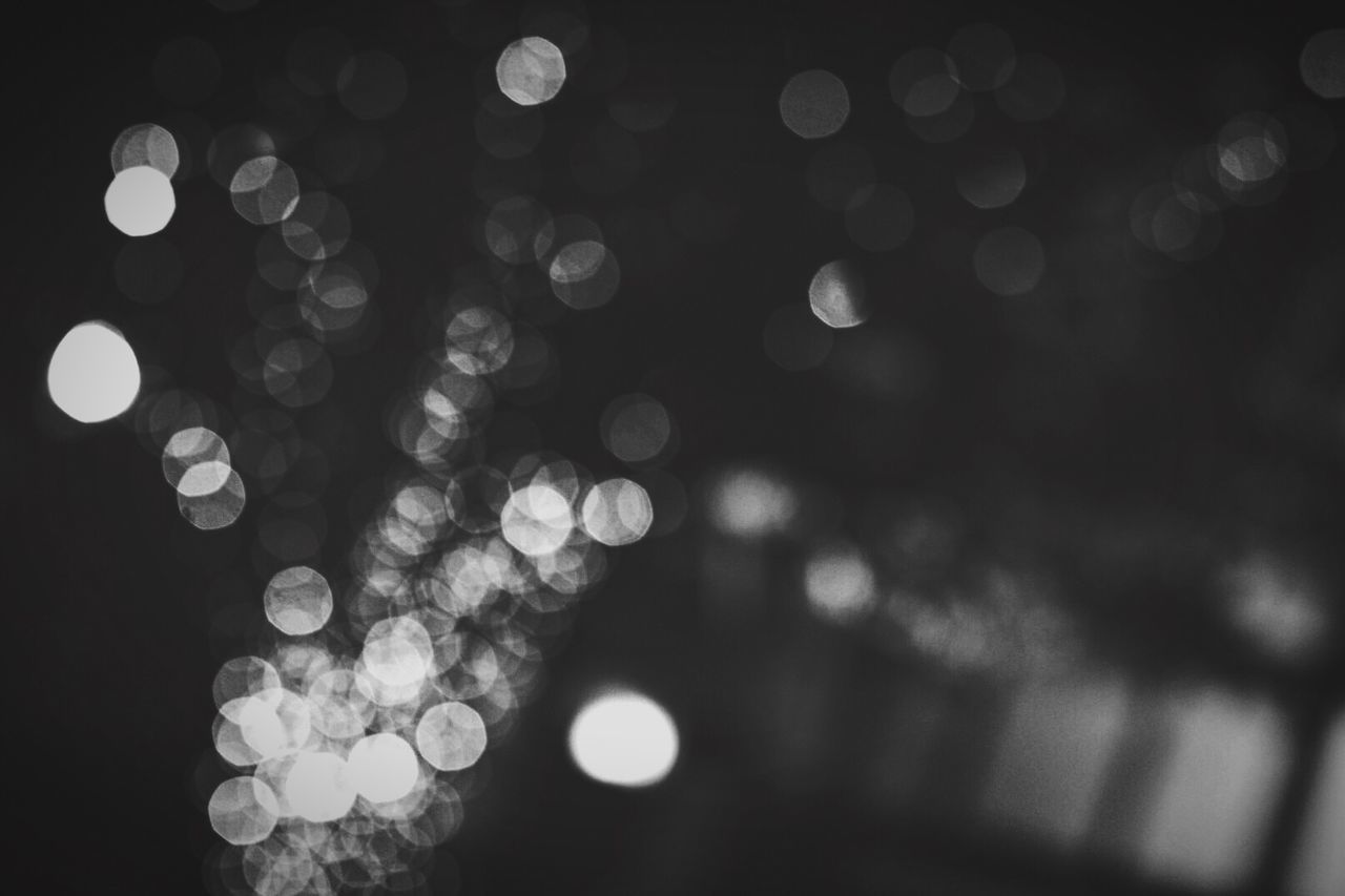 Defocused image of illuminated city at night