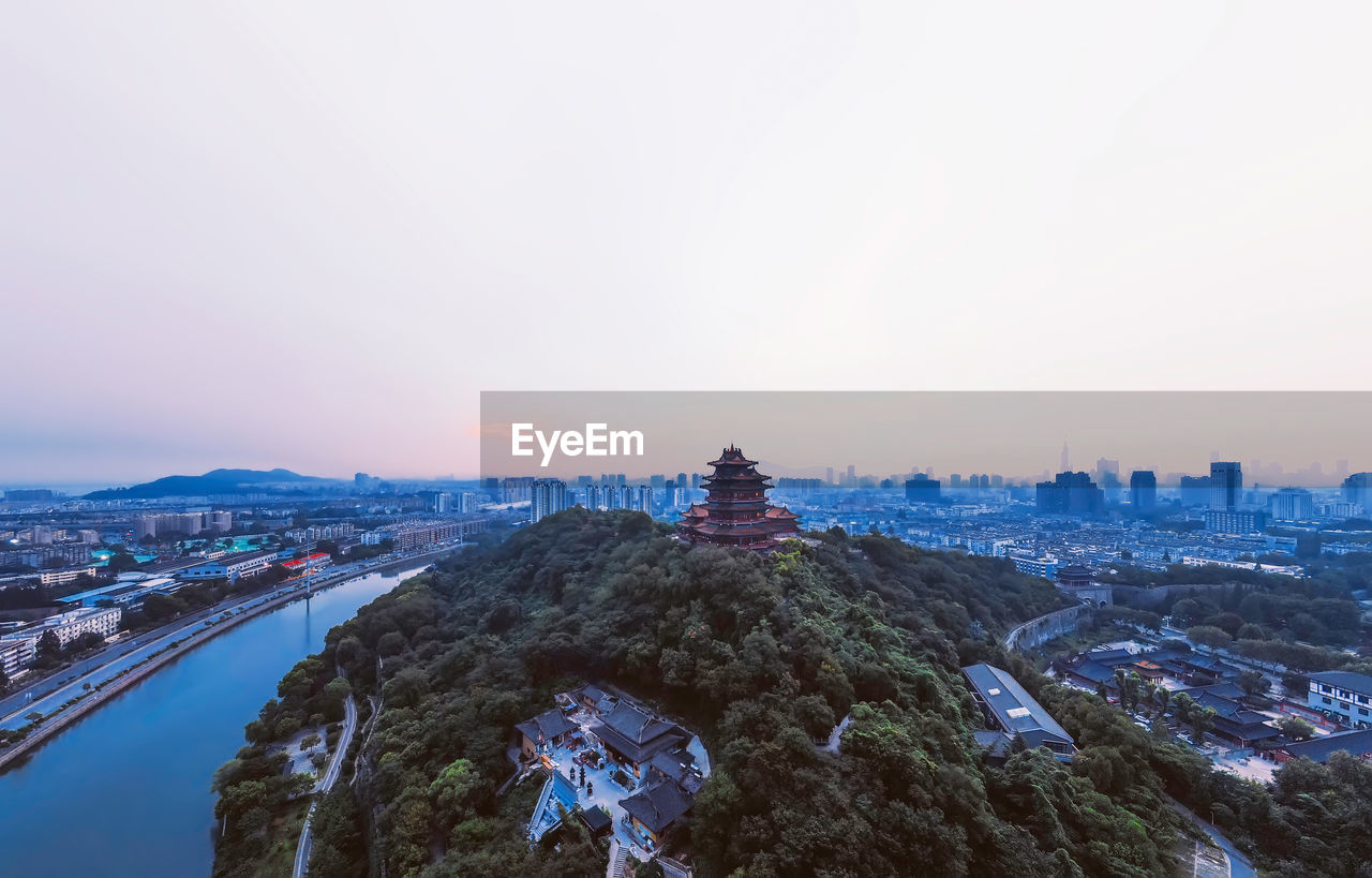 Aerial view of city buildings against sky