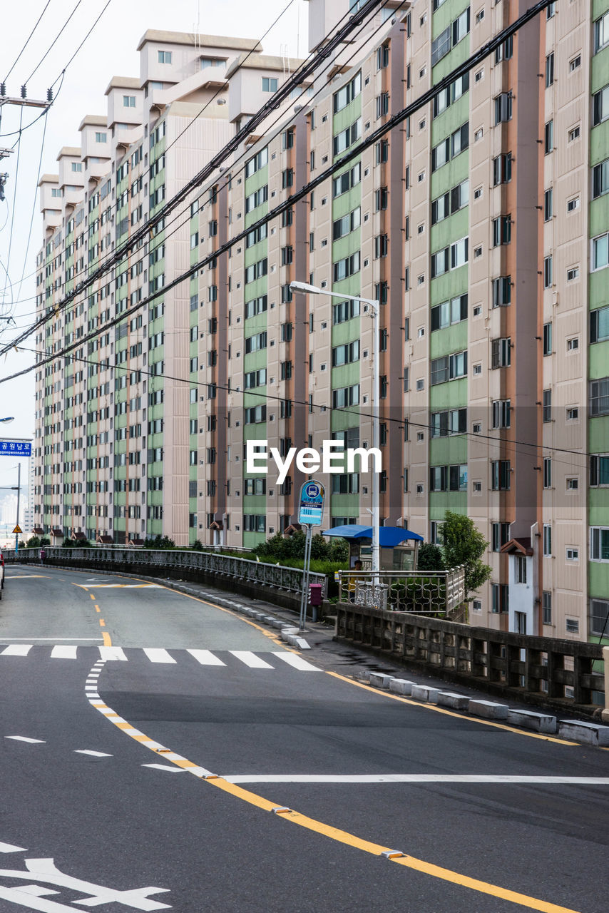 Empty highway by residential building