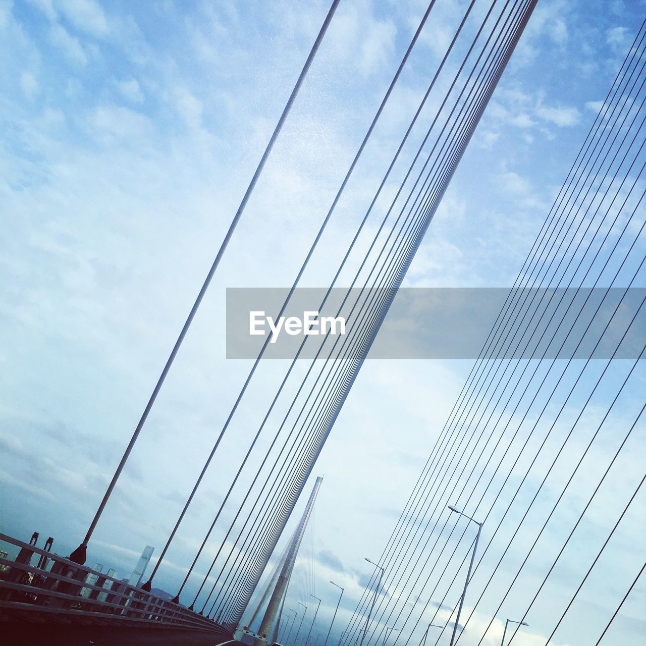 LOW ANGLE VIEW OF CABLES AGAINST SKY