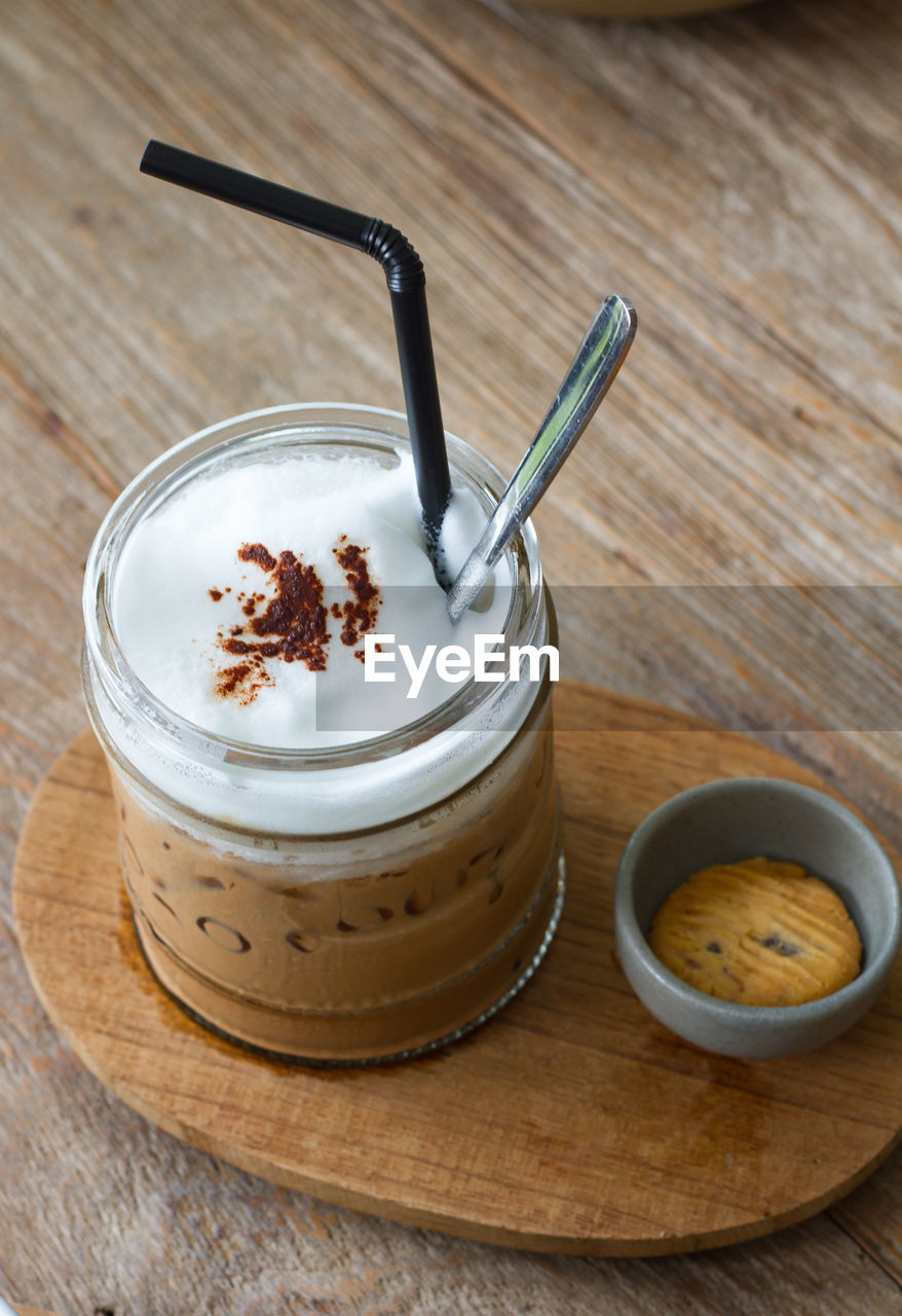 Cappuccino coffee on wood background