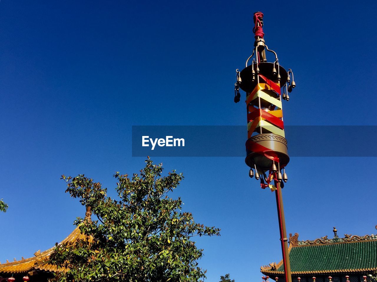 LOW ANGLE VIEW OF FLAG AGAINST BLUE SKY