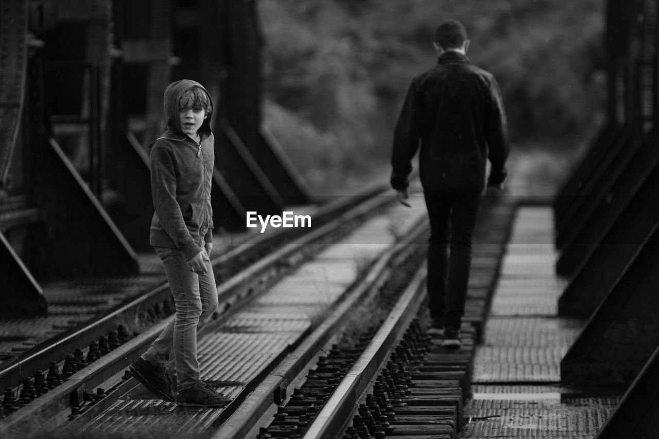 Brothers on railroad track