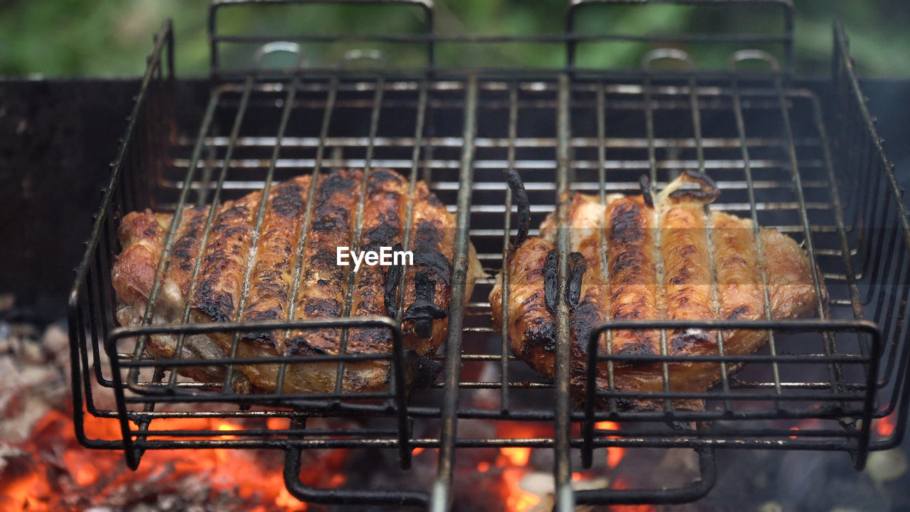 Barbecue with delicious grilled meat on the grill.barbecue meat is fried grill grate.