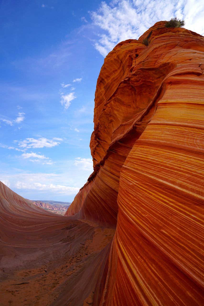 View of rock formation against cloudy sky