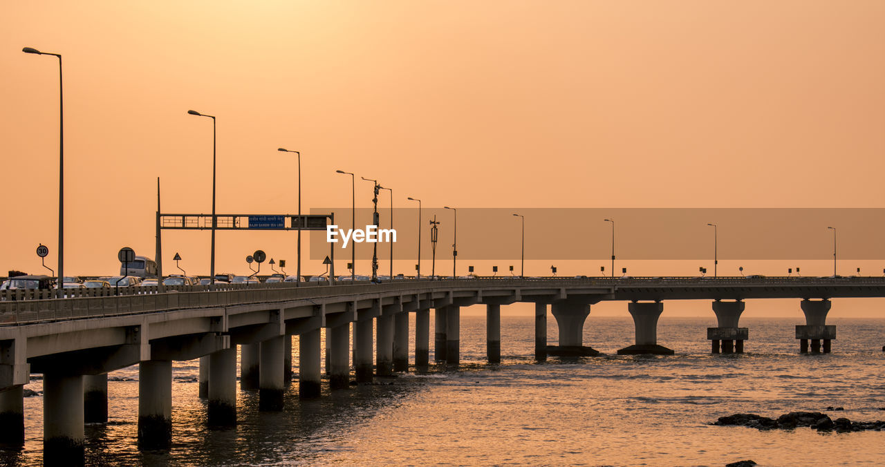 Sea link bridge over river against sky during sunset in mumbai 