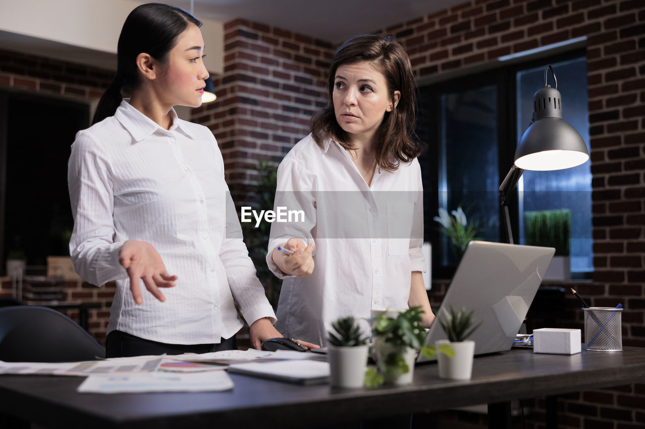 Portrait of smiling businesswoman working at office