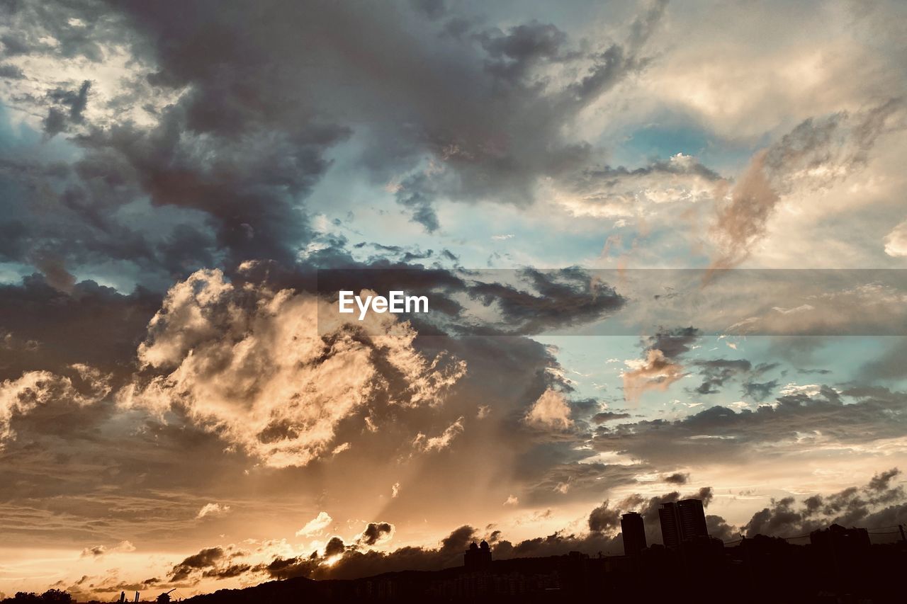 Low angle view of dramatic sky during sunset