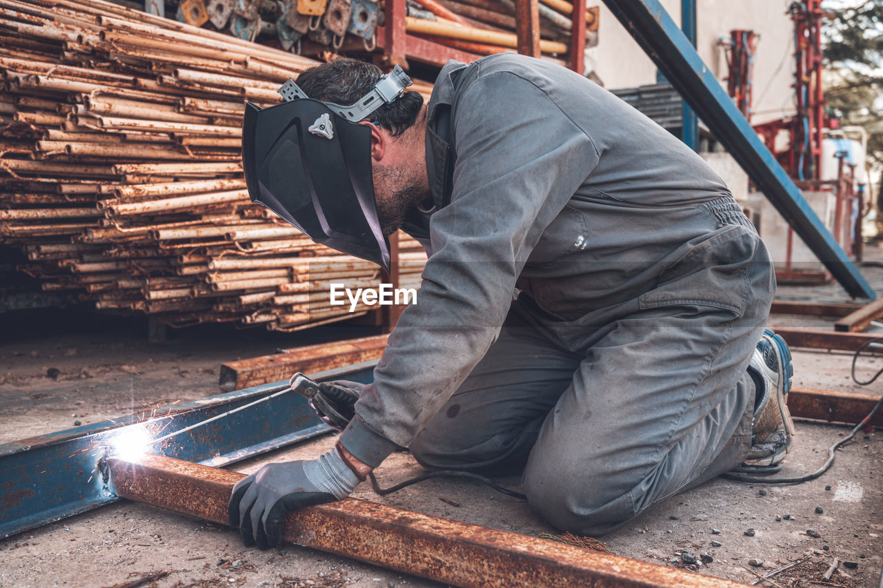 MAN WORKING IN CONTAINER