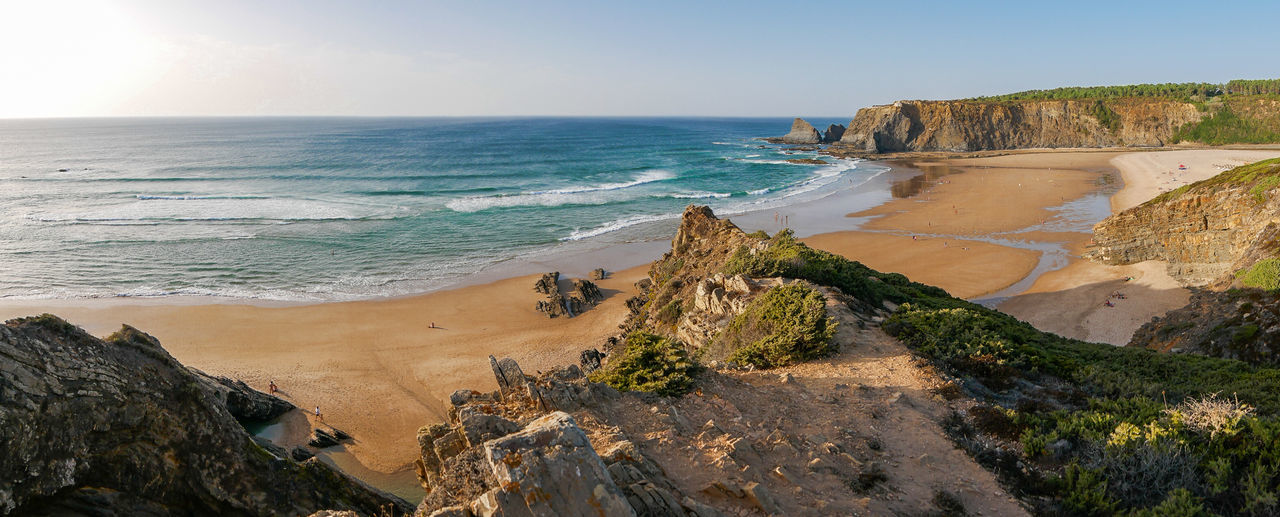 Scenic view of beach against clear sky