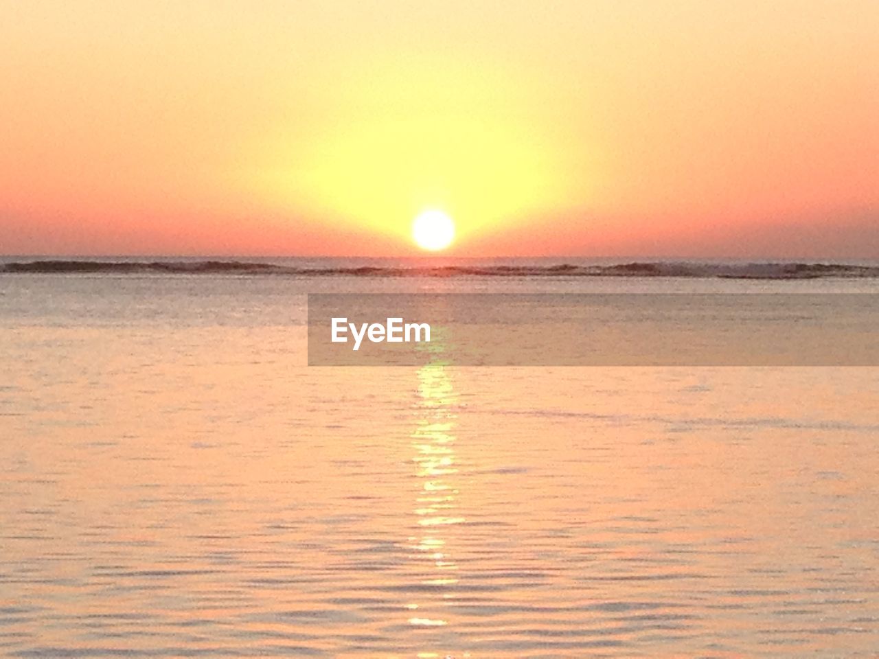 SCENIC VIEW OF SEA DURING SUNSET