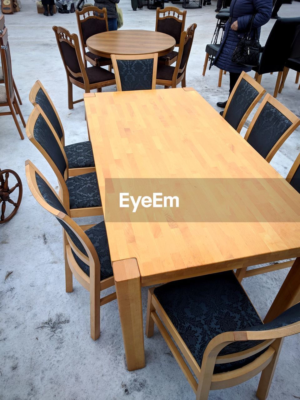 EMPTY CHAIRS AND TABLES AT RESTAURANT