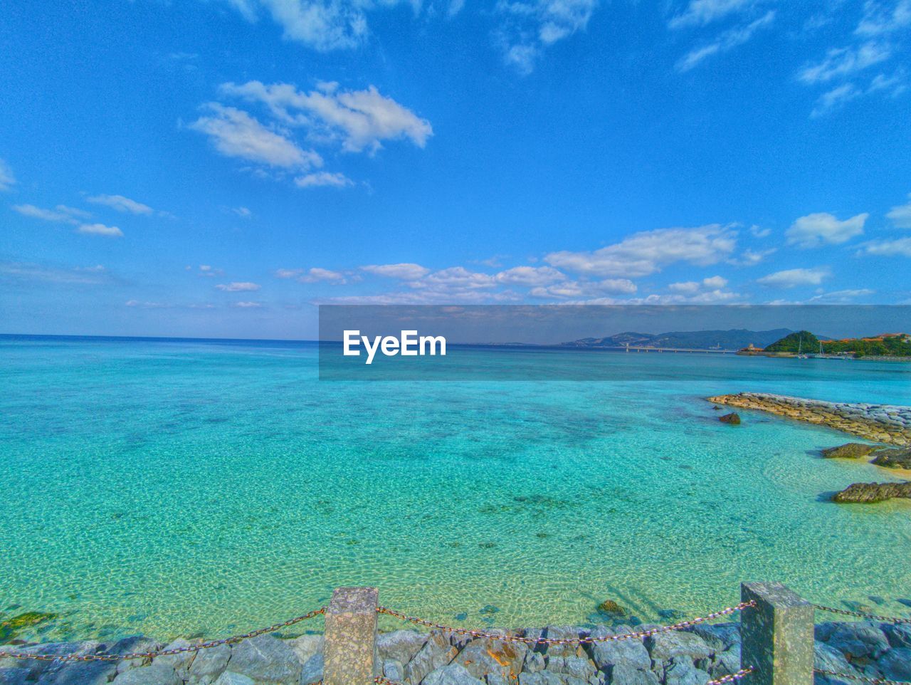 water, sea, sky, land, beauty in nature, scenics - nature, beach, nature, tranquility, blue, cloud, tranquil scene, travel destinations, shore, ocean, idyllic, travel, turquoise colored, body of water, lagoon, coast, tropical climate, holiday, vacation, trip, island, horizon, sand, horizon over water, day, tourism, no people, outdoors, environment, landscape, bay, tree, seascape, reef, islet, coastline, cay, summer, non-urban scene, sunlight, relaxation, plant