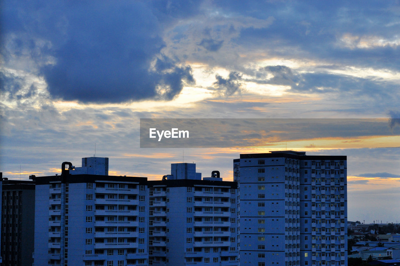 View of residential buildings against sky