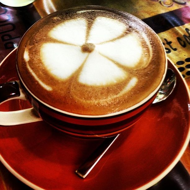 CLOSE-UP OF COFFEE CUP WITH COFFEE CUP