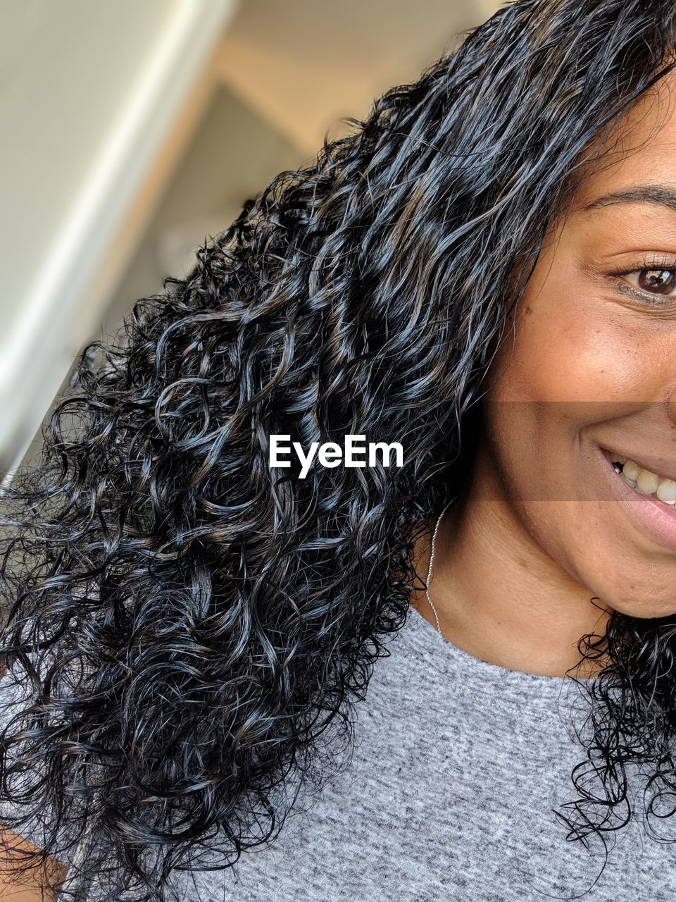 Close-up of smiling woman looking away